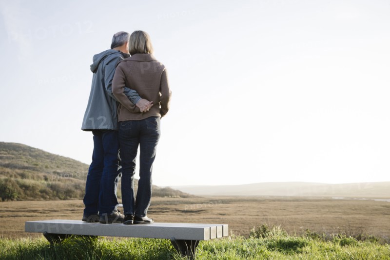 Caucasian couple hugging on beach