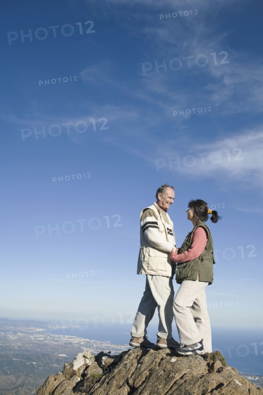 Senior couple on top of cliff