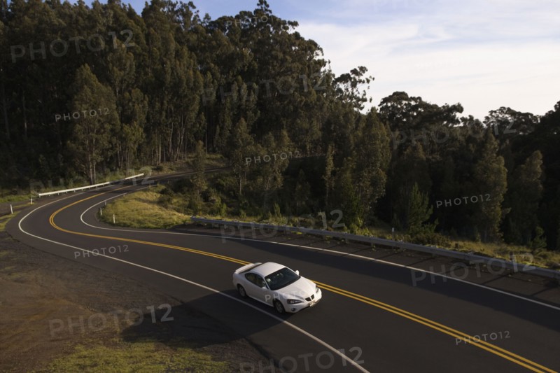 High angle view of car driving on winding road