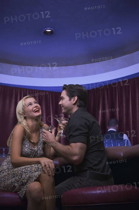 Couple laughing at nightclub