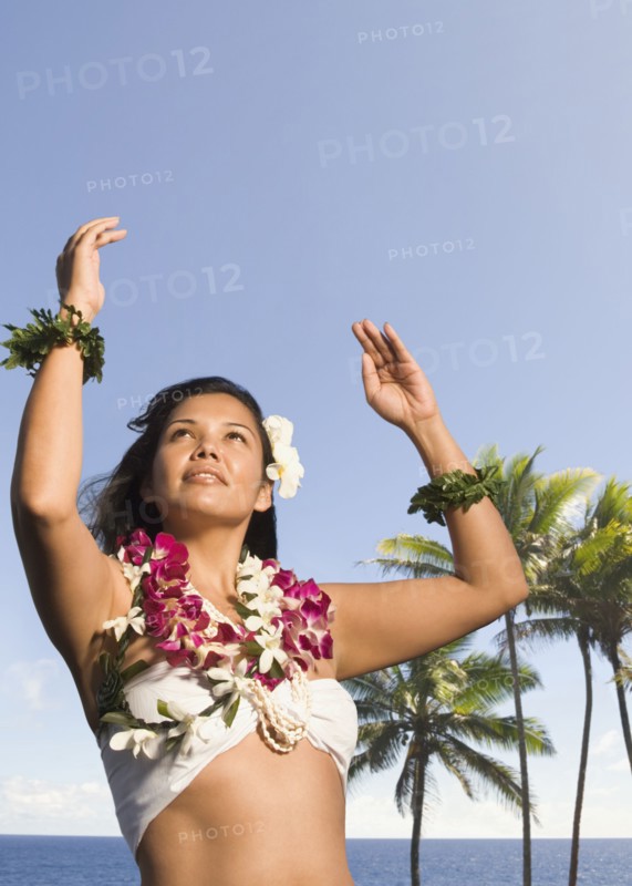 Pacific Islander woman in lei dancing