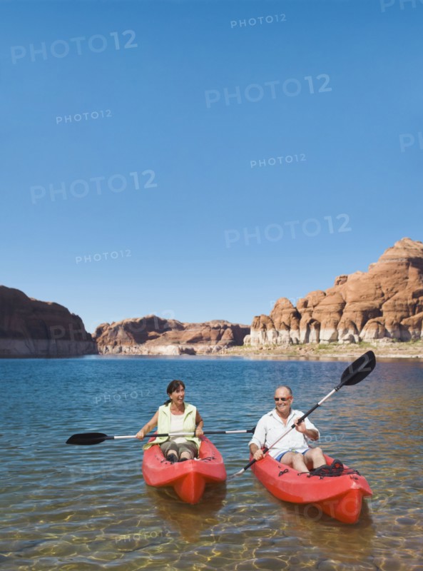 Multi-ethnic seniors kayaking