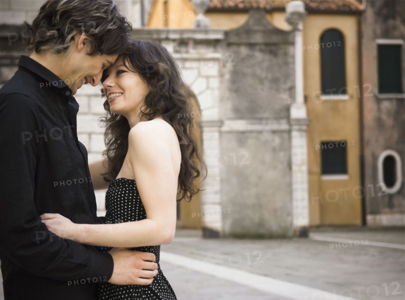 Italian couple hugging outdoors