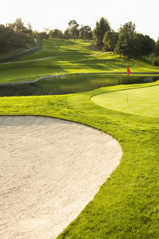 Sand trap and pond on golf course