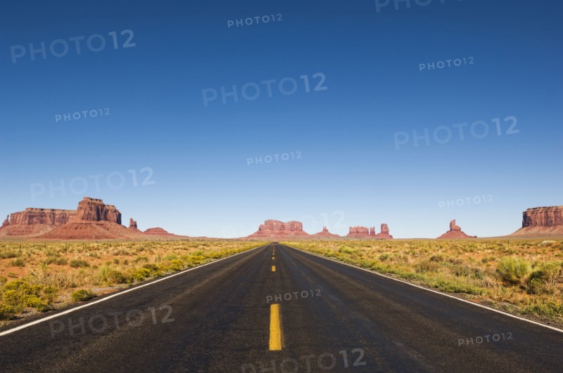 Highway and rock formations in desert