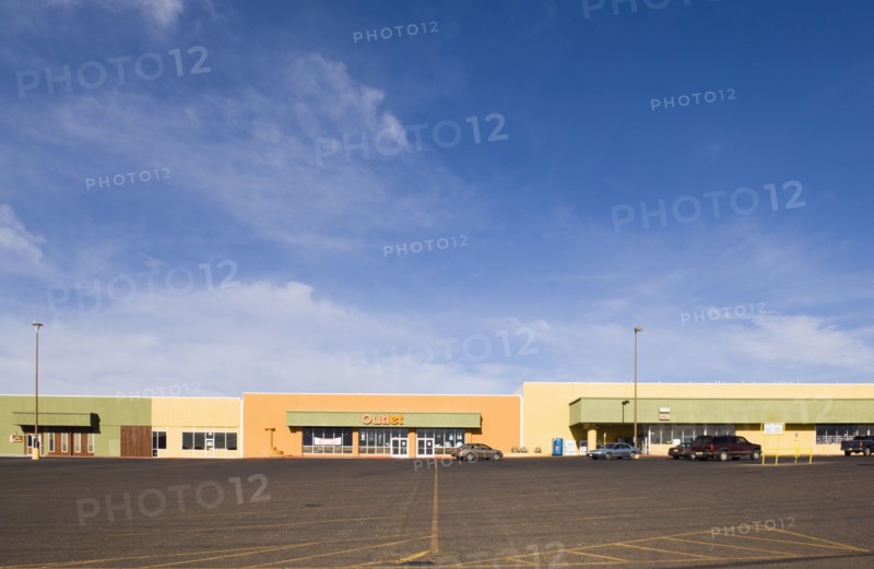 Empty parking lot in strip mall