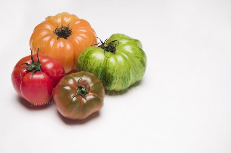 Four colorful tomatoes
