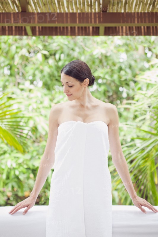 Caucasian woman in spa wrapped in a towel