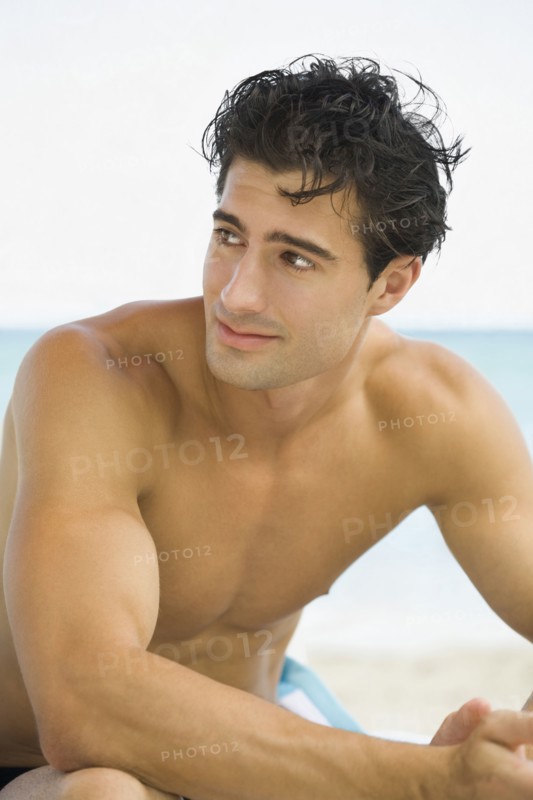 Caucasian man sitting outdoors