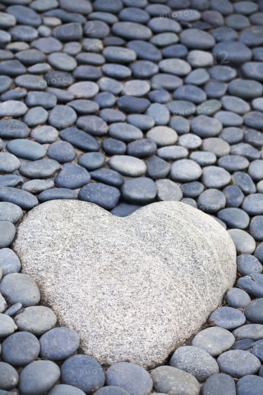 Heart-shaped stone on path
