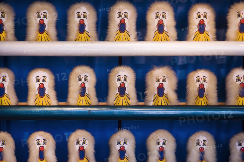 Amusement park shooting game targets on shelves