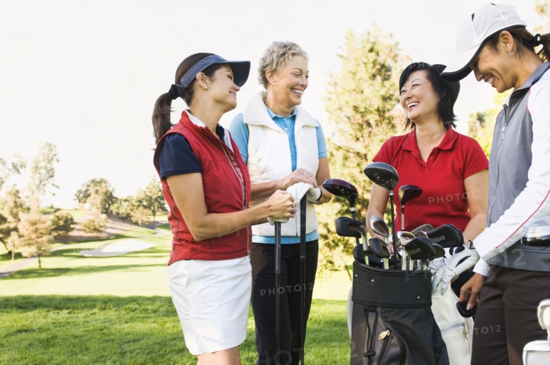 Women talking on golf course