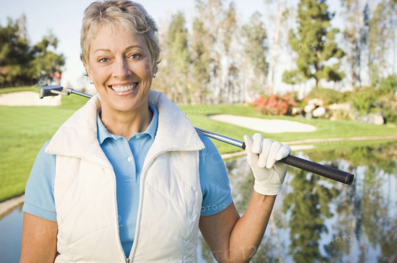 Caucasian woman smiling on golf course