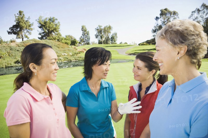 Women talking on golf course