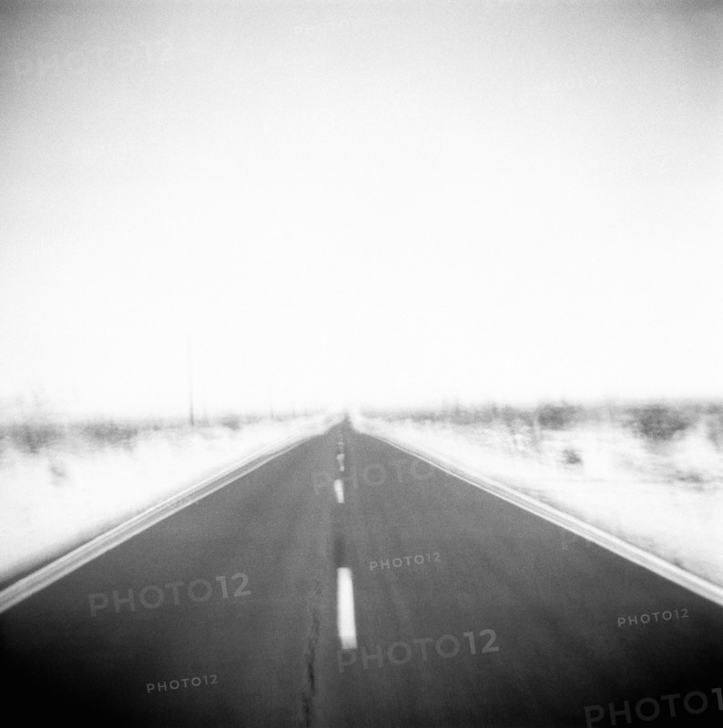 Defocused view of empty road
