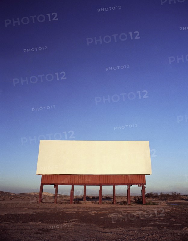Blank billboard in remote landscape