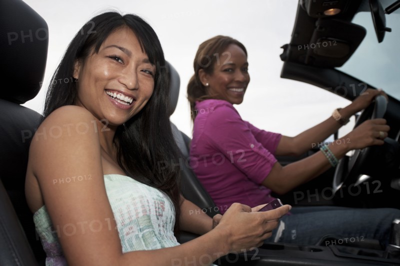 Friends driving in convertible