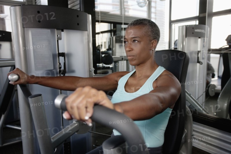 African American woman exercising in health club
