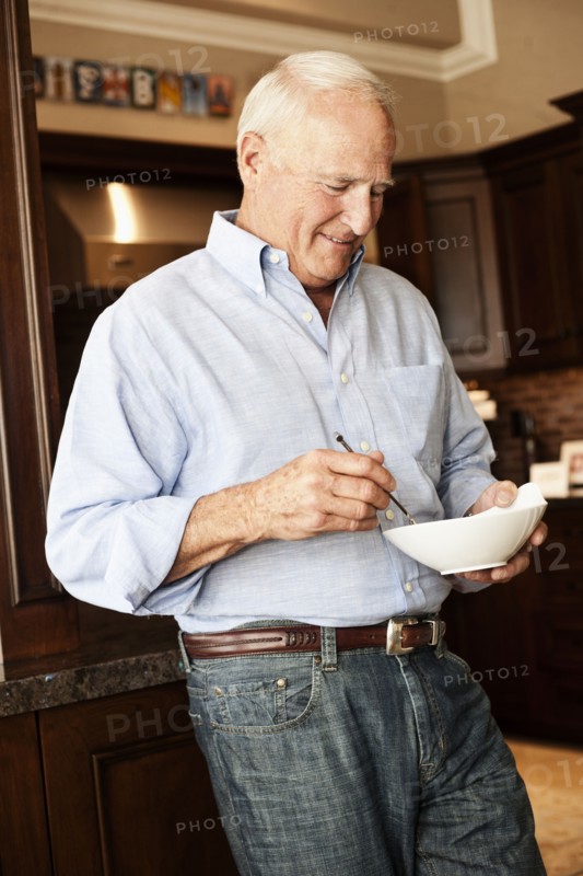 Caucasian man holding bowl