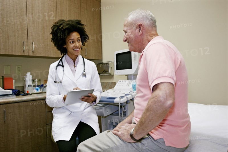 Doctor talking to patient in office