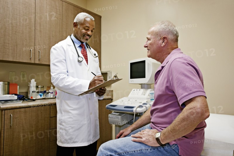Doctor talking to patient in office