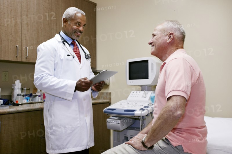 Doctor talking to patient in office