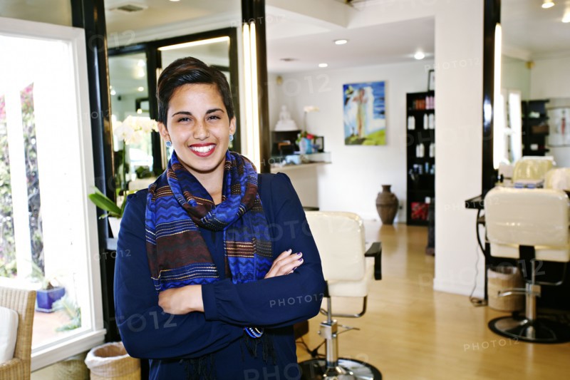 Hispanic woman smiling in salon