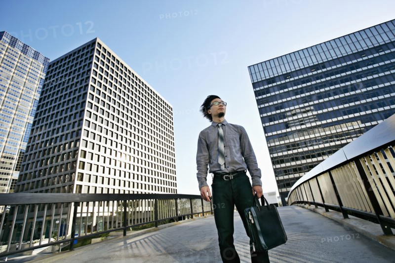 Asian businessman on urban walkway