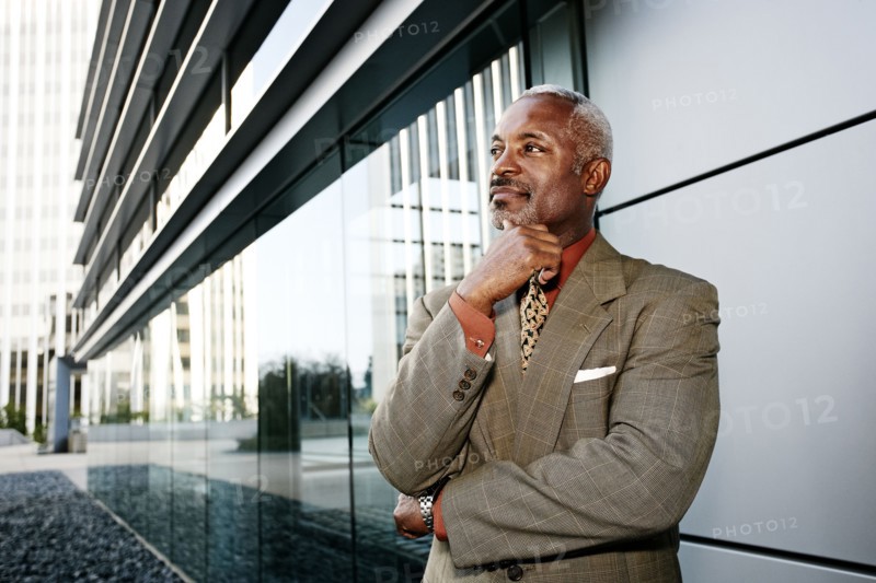 Black businessman smiling outside office