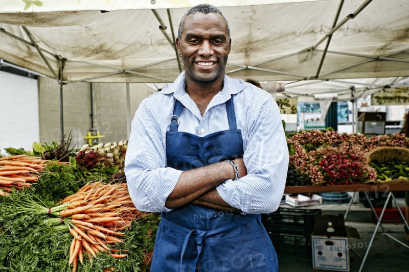 Black man working at outdoor market
