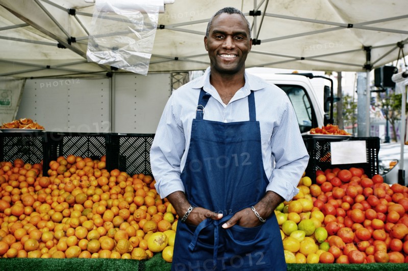 Black man working at outdoor market