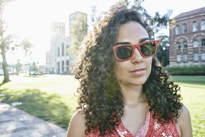 Mixed race student walking on campus