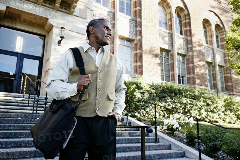 African American professor walking on campus