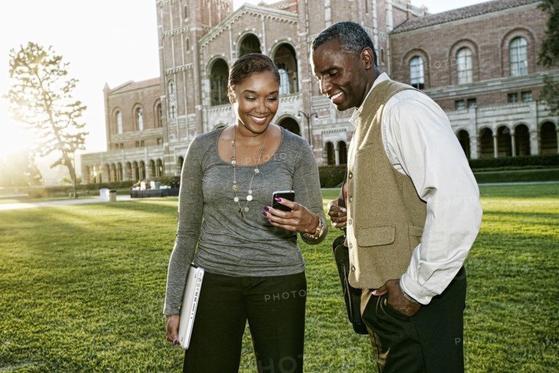 African American professors talking on campus