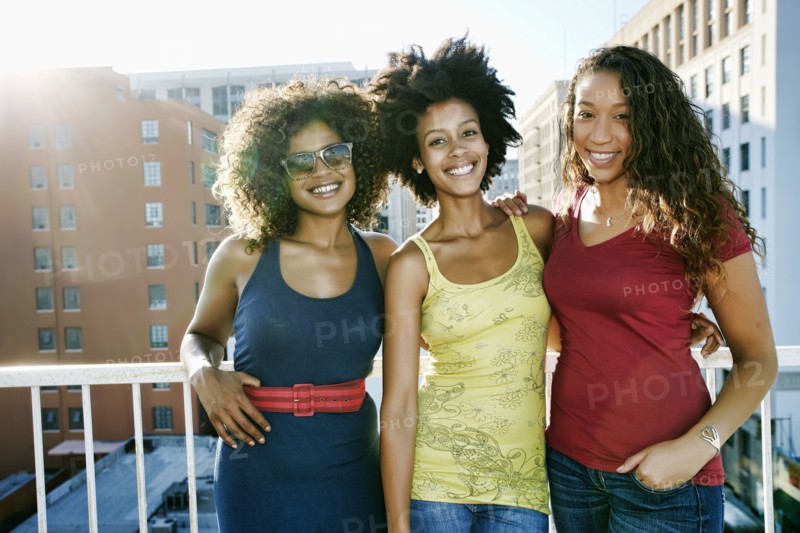 Mixed race women on urban rooftop