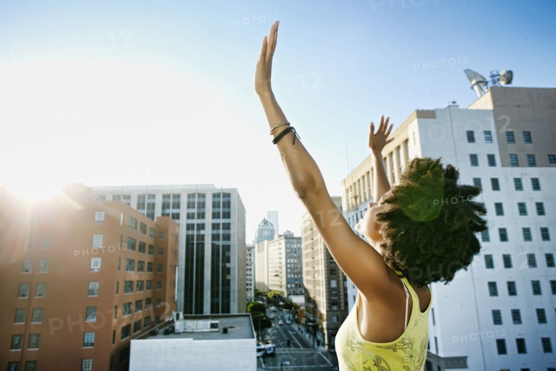 Mixed race woman on urban rooftop