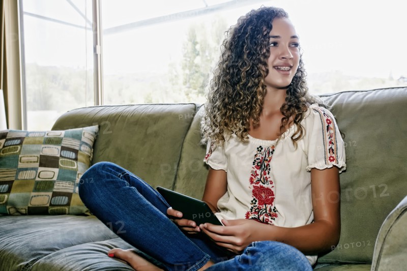 Mixed race girl using digital tablet