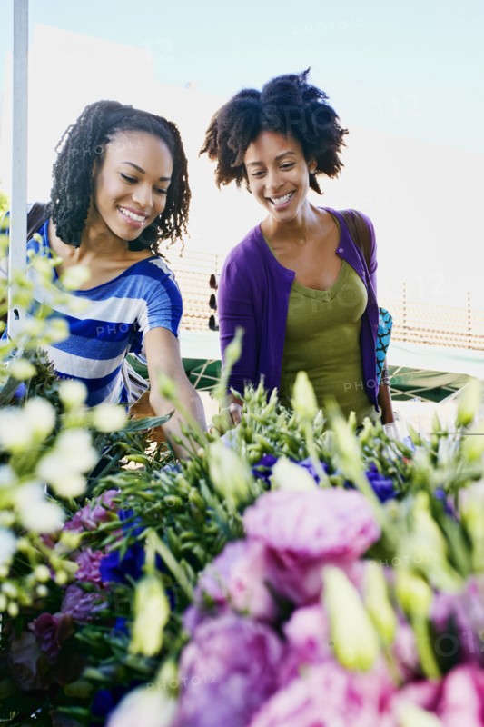 Women shopping together at flower market
