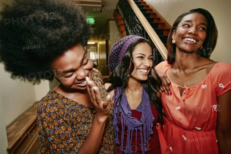 Women laughing in apartment building