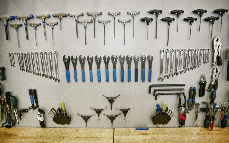 Tools arranged neatly on shop wall