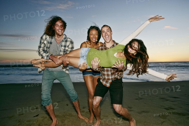 Friends posing together on beach
