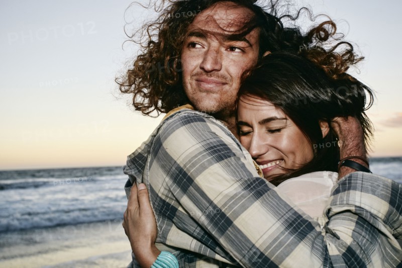 Couple hugging on beach