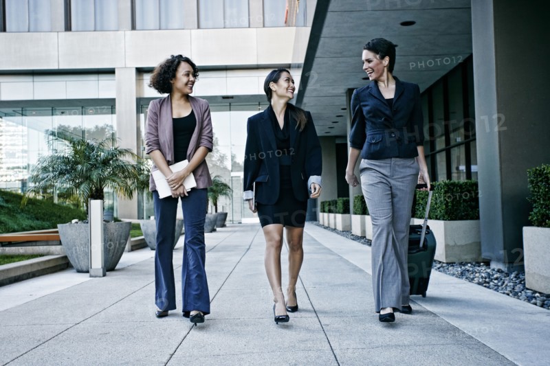 Businesswomen walking together outdoors