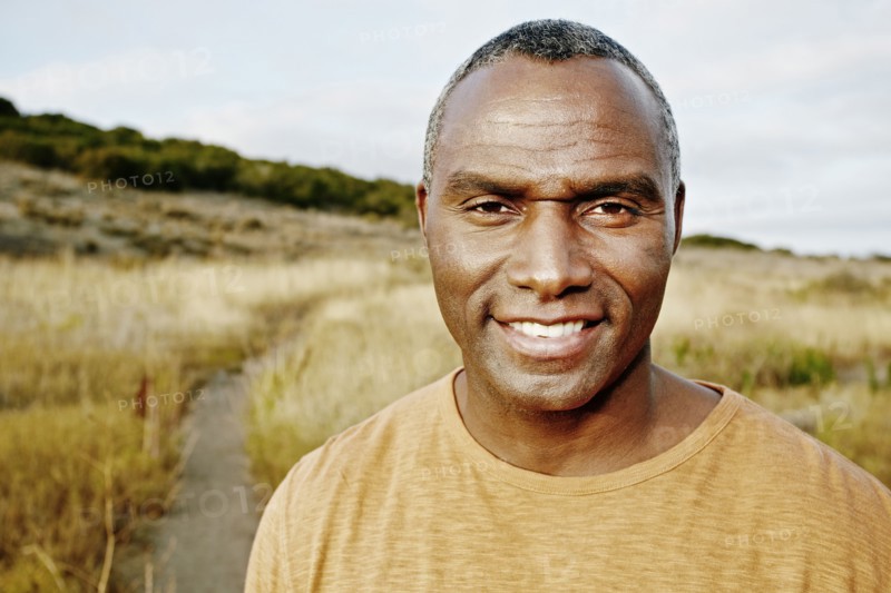 Black man standing on rural path