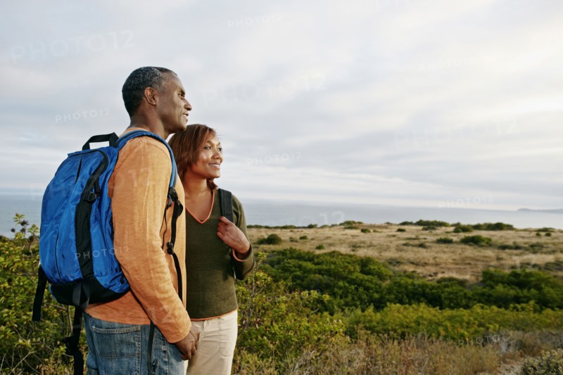 Black couple overlooking rural hillside