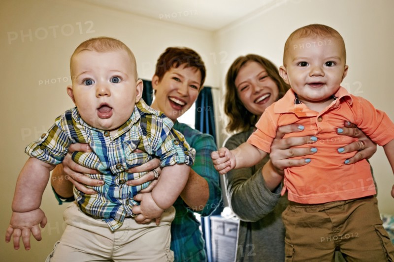 Caucasian mothers holding babies