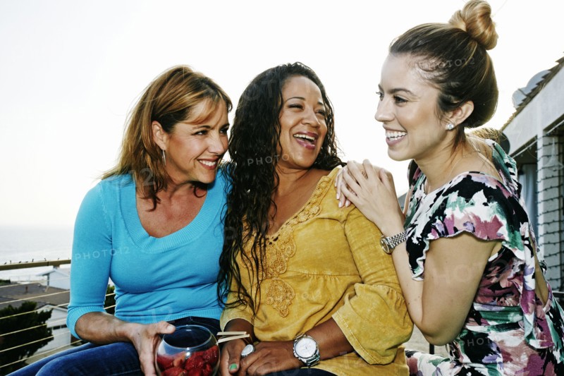 Women relaxing together at waterfront