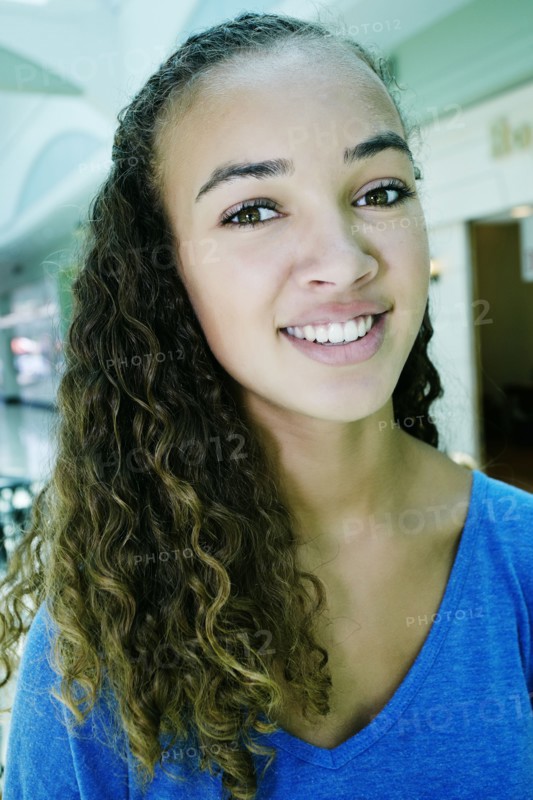 Close up of mixed race teenage girl smiling