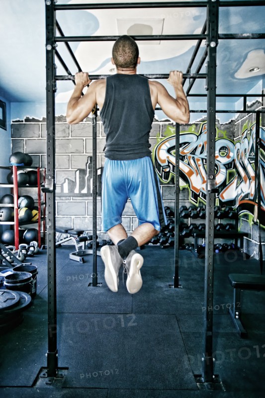 African American man exercising in gym