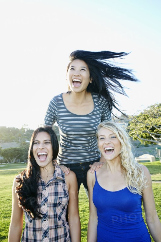 Women playing in field outdoors
